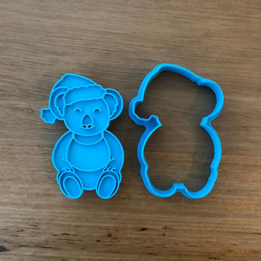 Christmas Koala wearing Singlet Cookie Cutter with optional Stamp measures approx. 80mm tall by 55mm wide.  This Koala design comes with the option of choosing the outline cutter only, or adding the optional stamp which you can use on fondant or straight on to cookies.