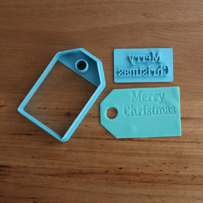 Merry Christmas Stamp Emboss and Gift Tag Cookie Cutter  This gift tag shaped cutter measures 80mm (w) x 50mm (h) and the Merry Christmas stamp measures 50mm (w) x 24mm (h) allowing you to position the stamp where you'd like and leave space to add a personalised name using your own Alphabet stamp kit, or order your own from us in store. This provides a cost effective way to personalise your cookie gifts  