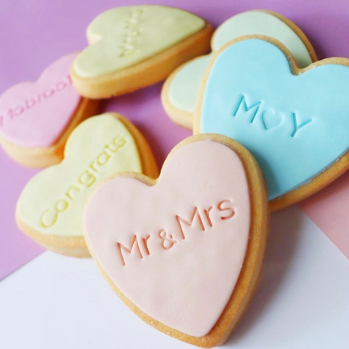 Our mini & sign cookie stamp measures 7mm, 1/4” tall and is perfect to customise all of your special occasion cookies without needing to buy a custom stamp.