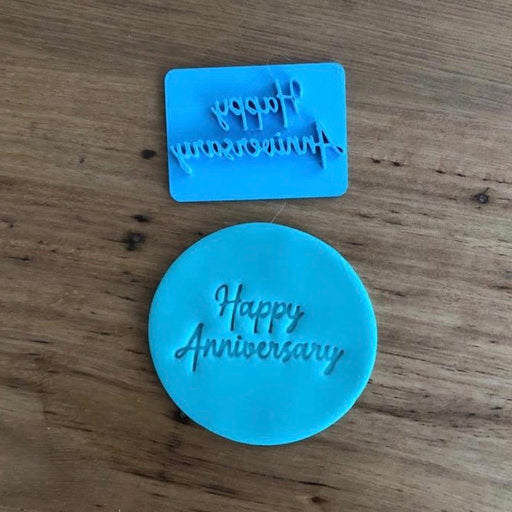 Happy Anniversary Style #1 Emboss Stamp. The words measure 45mm wide and 25mm tall and this stamp is perfect for customising your own cookies by placing the text anywhere your design requires, allowing you to place names, numbers or decorations around the text.