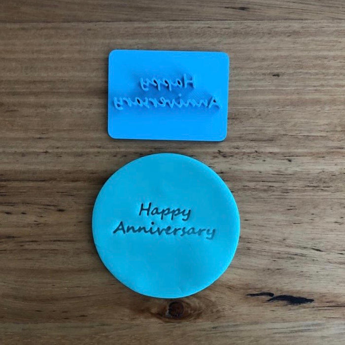 Happy Anniversary Style #2 Emboss Stamp. The words measure 45mm wide and 15mm tall and this stamp is perfect for customising your own cookies by placing the text anywhere your design requires, allowing you to place names, numbers or decorations around the text.  