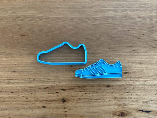 Running Training Shoe style #2 Cookie Cutter and Stamp Set measures approx. 47mm tall by 90mm wide. Adidas Superstar Style.  This has the option of choosing the cookie cutter outline only or with the fondant stamp as a set.   
